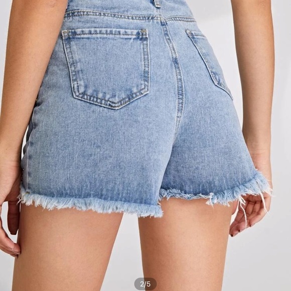 High wasted, denim shorts with a light wash. - Picture 2 of 2